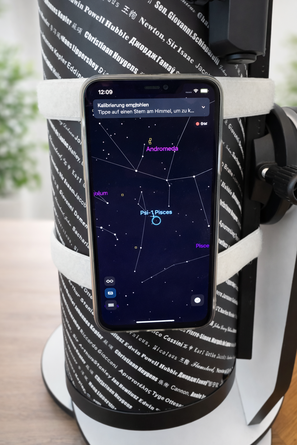 Close-up of phone on telescope tube with hook-and-loop straps